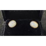 A pair of 9ct gold and opal stud earrings Modern