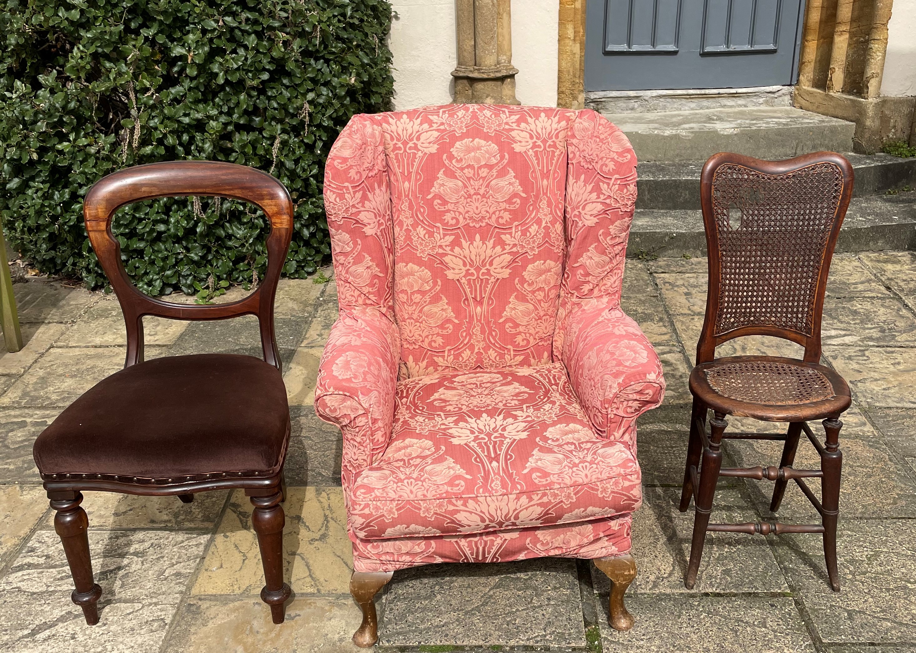 A 19th century deportment chair, a balloon back chair and wing back arm chair (3)