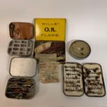 Assorted fishing lures, a leather reel box, a Hardy's cardboard box, various fly tins, and other