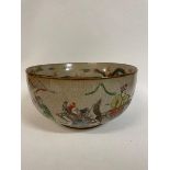 A Chinese famille rose low comport, decorated birds and foliage on a celadon ground, 27 cm diameter,