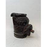 A carved wood tobacco box and cover, in the form of a dog, 18 cm high Modern
