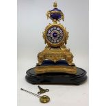 An early 20th century French mantle clock, with an 8 cm porcelain dial, decorated flowers, in a gilt