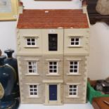 **Withdrawn** A late 20th century dolls house in the Georgian style, 64 cm wide, with various