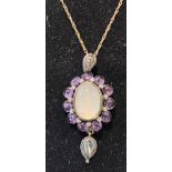 A silver, 9ct gold, moonstone, amethyst and diamond necklace Modern