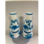 A pair of Chinese Peking style glass blue and white glass vases, decorated flowers, 23 cm high (2)