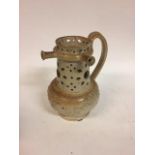 A 19th century salt glazed stoneware puzzle jug, decorated hunting scene, 22 cm high Small losses to