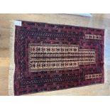 A Persian red ground prayer mat, 100 x 147 cm