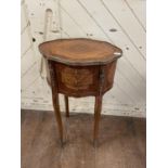 A French bedside chest, of shaped oval form, with three drawers, 42 cm wide