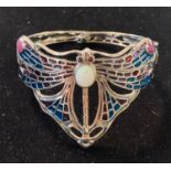 A silver, opal, ruby and sapphire dragonfly bangle Modern