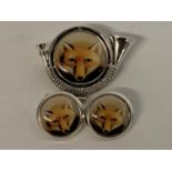 A pair of silver fox enamel cufflinks, and a horn brooch