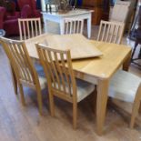 An Ercol modern oak, extending dining table, 89 x 140 cm with an extra leaf, extended 193 cm and six