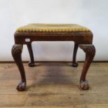 A George III style mahogany stool, on shell carved cabriole legs, 53 cm wide