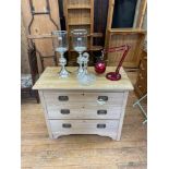 A pine dressing chest, 91 cm wide, a pair of candle holders, a decanter, a lamp, a metal folding