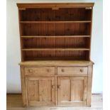 A pine dresser, the top with four shelves, on a base with two drawers and two cupboard doors, 160 cm