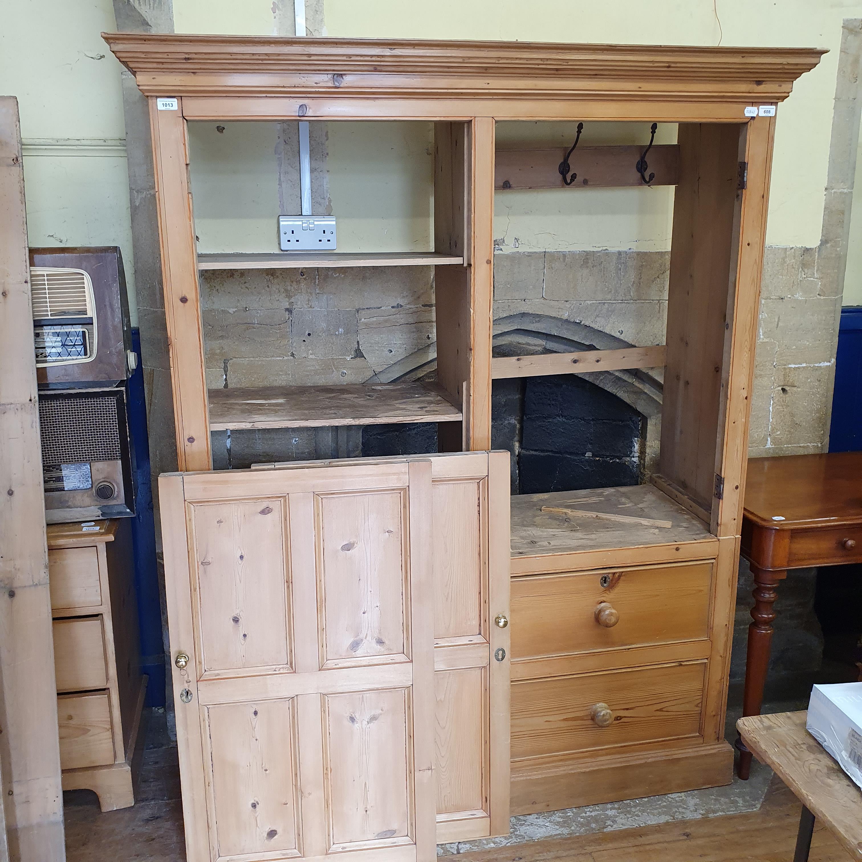 A pine wardrobe, with two cupboard doors, above two short and one long drawer, 150 cm wide, and a - Image 2 of 3