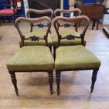 A set of four 19th century rosewood balloon back dining chairs (4)