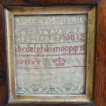 A 19th century sampler, 11 x 10 cm, in rosewood frame Sampler very faded