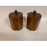 A pair of hexagonal tea caddies and covers, veneered in walnut, 18.5 cm high (2) both in good