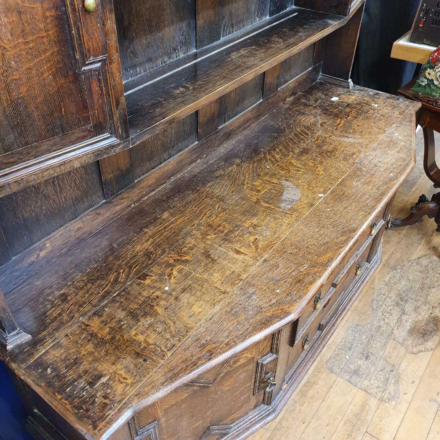 An oak dresser, top with two cupboard doors and two tier plate rack, base having two drawers and two - Image 2 of 5