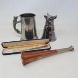 A copper and nickel hunting horn, 22.5 cm, a silver plated fox stirrup cup, 13.5 cm, a silver letter