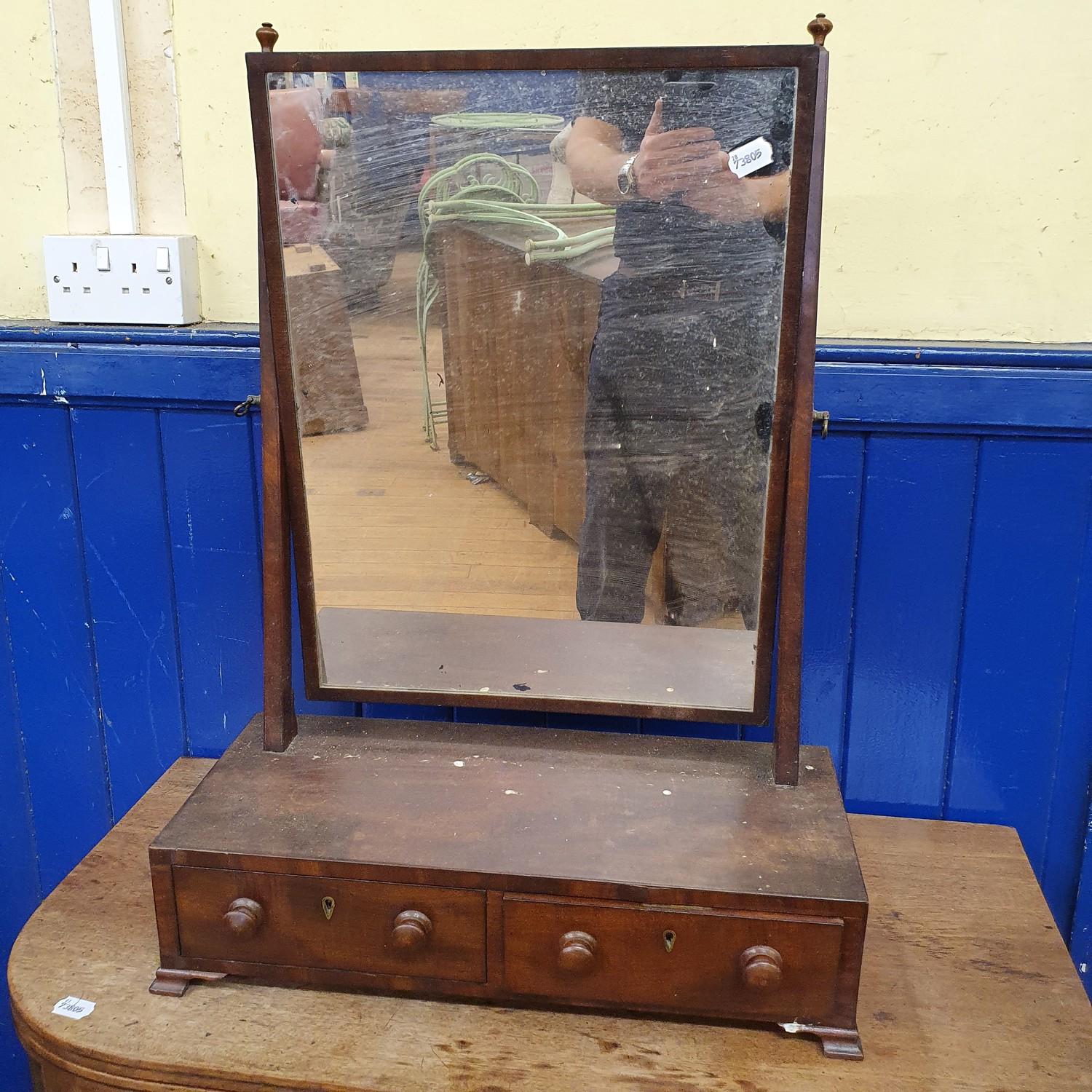 A 19th century mahogany bedroom mirror, base with two drawers, on bracket feet, 53 cm wide