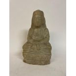A carved marble Buddha, seated, on a lotus carved base, 19.5 cm high Some chips, mostly to base