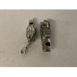 A silver owl whistle, and a similar frog whistle frog whistles well, owl not so good, these are