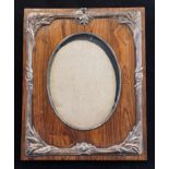 A large Art Nouveau style silver mounted wooden strut photograph frame, decorated bulrushes, 33 cm