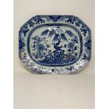 An early 19th century Chinese meat plate, decorated flowers and foliage in underglaze blue, rim
