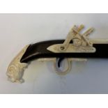 A walking stick, the carved bone handle in the form of a flintlock gun, 91 cm Modern