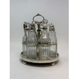 An early 19th century cruet frame, with glass bottles, 22 cm high