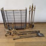 A brass wirework fender, 69 cm wide, two set of fire irons and a pair of fire dogs (qty) Ware due to