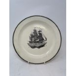 A 19th century creamware plate, bat-printed with a galleon, 25 cm diameter
