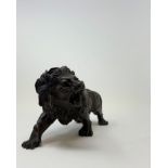 A bronze figure of a roaring lion, 15 cm high Modern