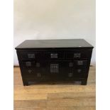 A Chinese lacquered cabinet, with five drawers and four doors, 145 cm wide 91 cm height, 62 cm