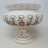A late 19th century Royal Worcester bowl, raised on round foot, decorated flowers, date mark for