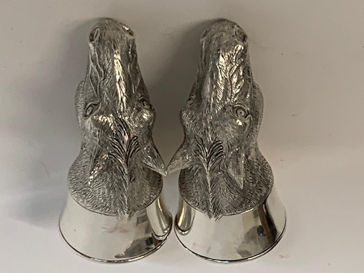 A pair of white coloured metal horse salt and pepper pots Modern