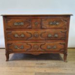 A French early 19th century serpentine front walnut commode, having two short and two long