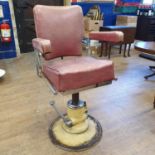 A barbers chair Mechanism not working, base rusted, seat with hole, in need of extensive