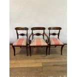 A set of twelve early 19th century style dining chairs, with shell carved backs and drop in seats,