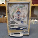 A Japanese Pachinko machine, manufactured by Nishijin, lacks back, 52 cm wide