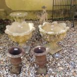 A pair of composite stone garden planters, diameter 48 cm, a pair of cast metal planters, 33 cm