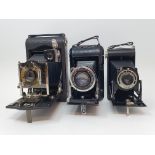A Kodak Regent folding camera, with leather outer case, a Kodak folding camera, with leather outer