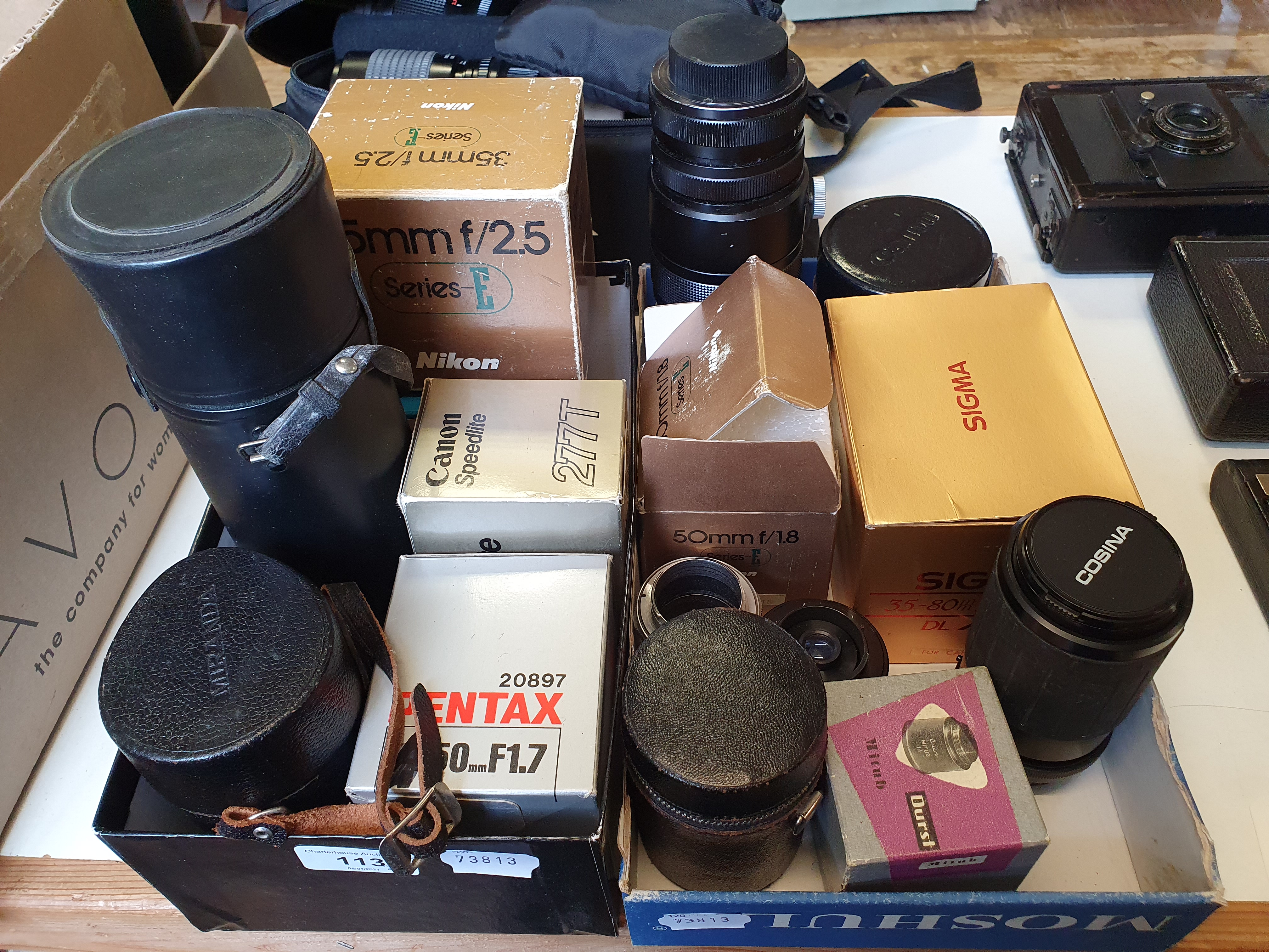 An Alto Welblick camera lens and various other camera lenses (2 boxes) Provenance: Part of a vast