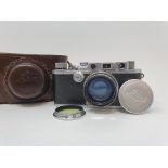 A Leica IIIa camera, serial number 324178, with leather outer case Provenance: Part of a vast single