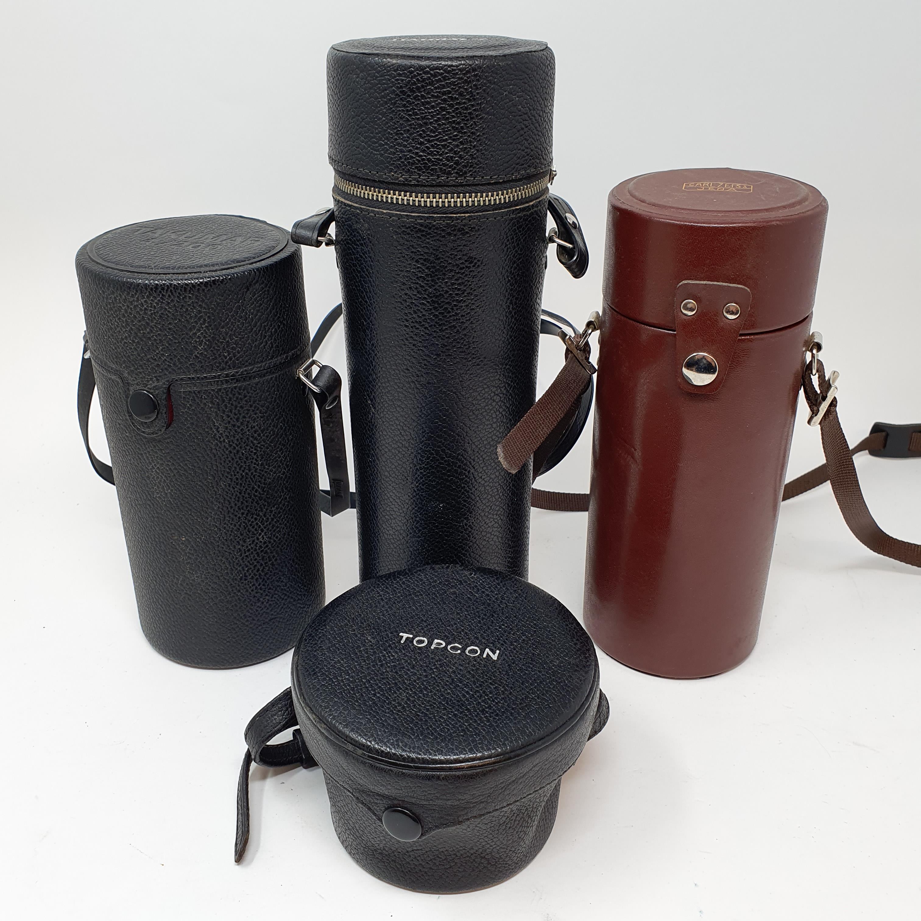 A Carl Zeiss Jena camera lens, in leather outer case, and three other camera lenses (box)