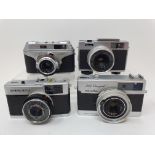 A Minolta 24 Rapid camera, an Arette C camera, a Ricoh Auto 126 camera, and an Olympus Trip 35