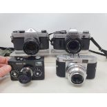 A Rollie 35 camera, a Voitlander Vito B Camera, a Canon AE-1 camera, and a Pentax SP 1000 (4)