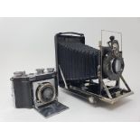 A Dollina folding camera, and a Kodak Compur folding camera, with outer leather case (2) Provenance: