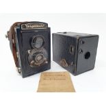 A Kodak box Brownie camera, with original instructions, in canvas outer case, and a Voigtlander